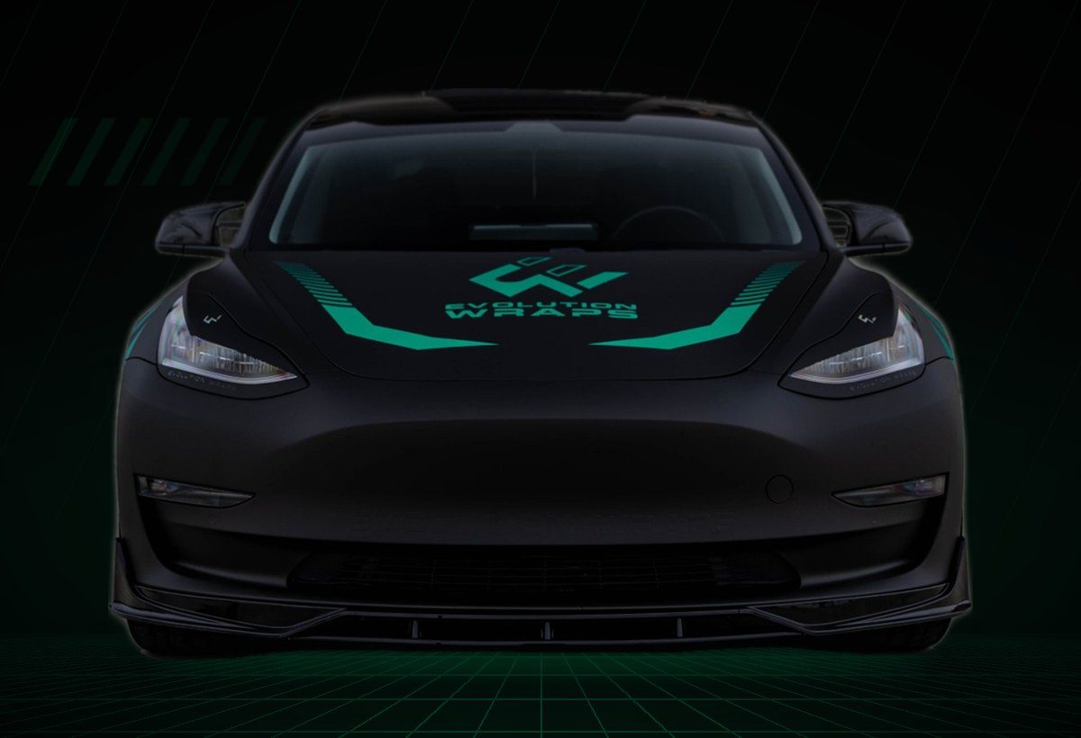 Tesla Model 3 wrapped in matte black with the Evolution Wraps teal livery